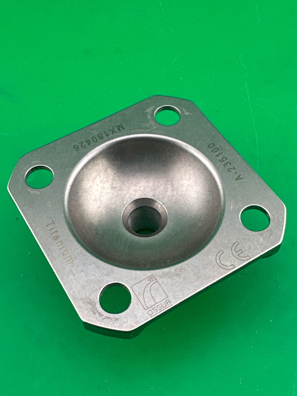 Ossur titanium 4 hole male pyramid prosthetic plate. A-235100.