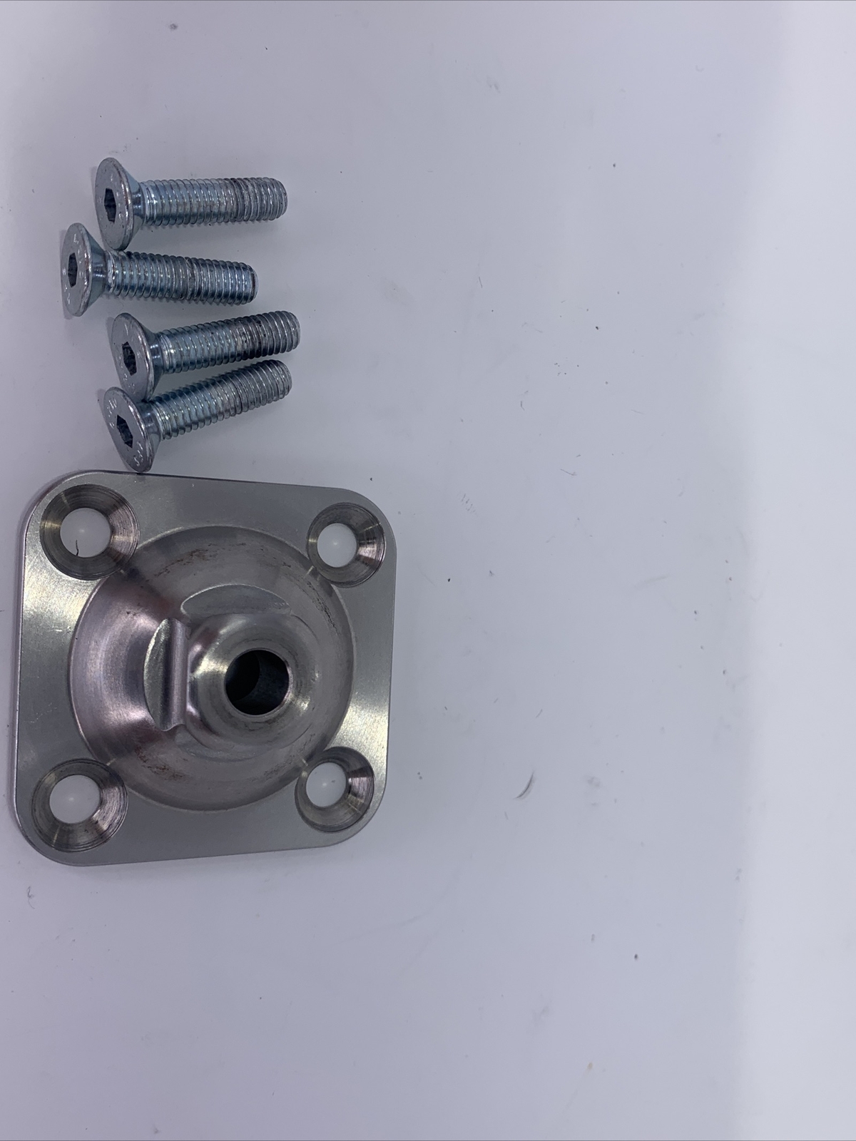 Bulldog prosthetic leg part, component, adapter, 4 hole male pyramid plate.