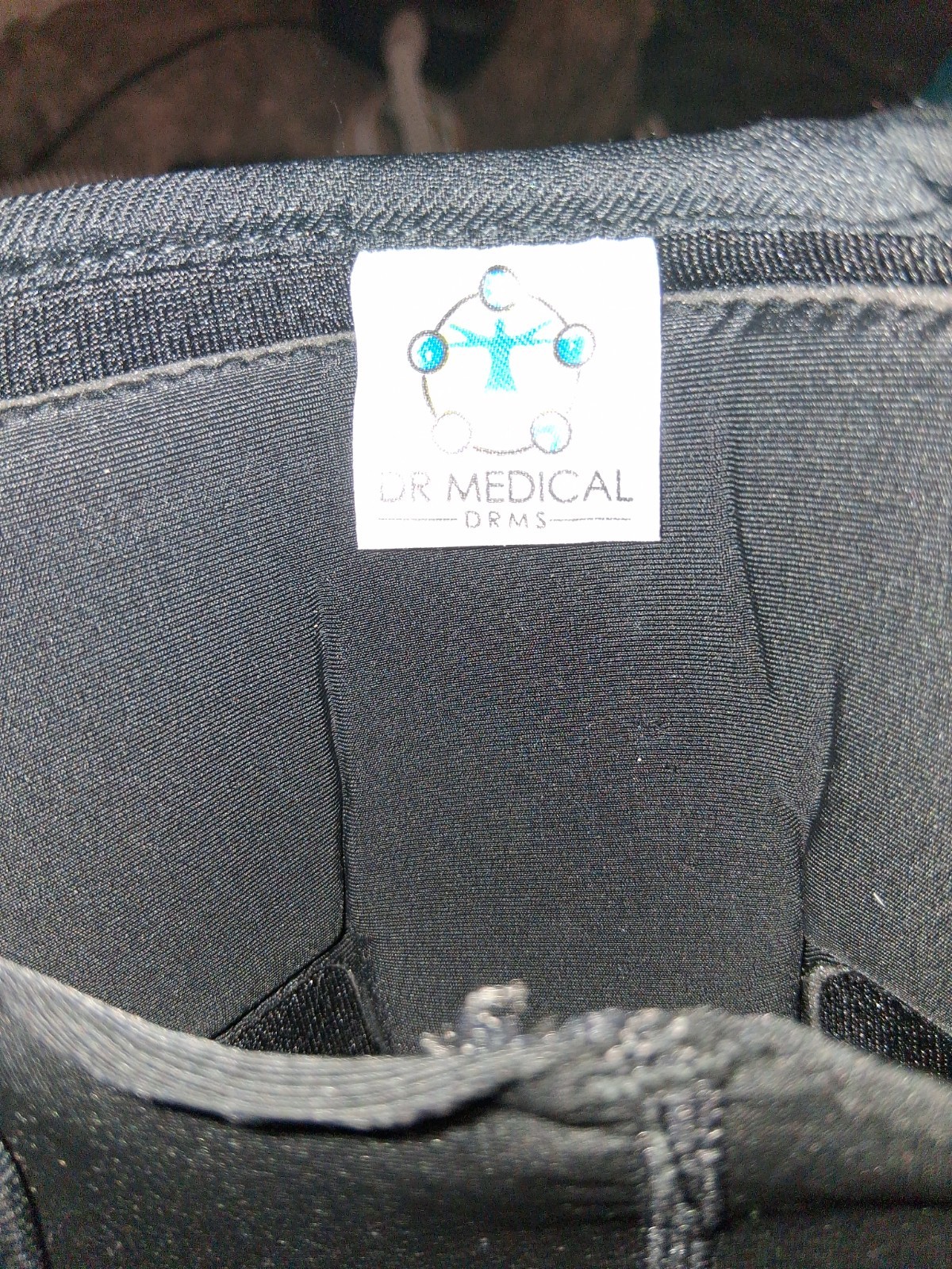 Dr. Medical branded wrist brace or splint, featuring a black mesh material Left
