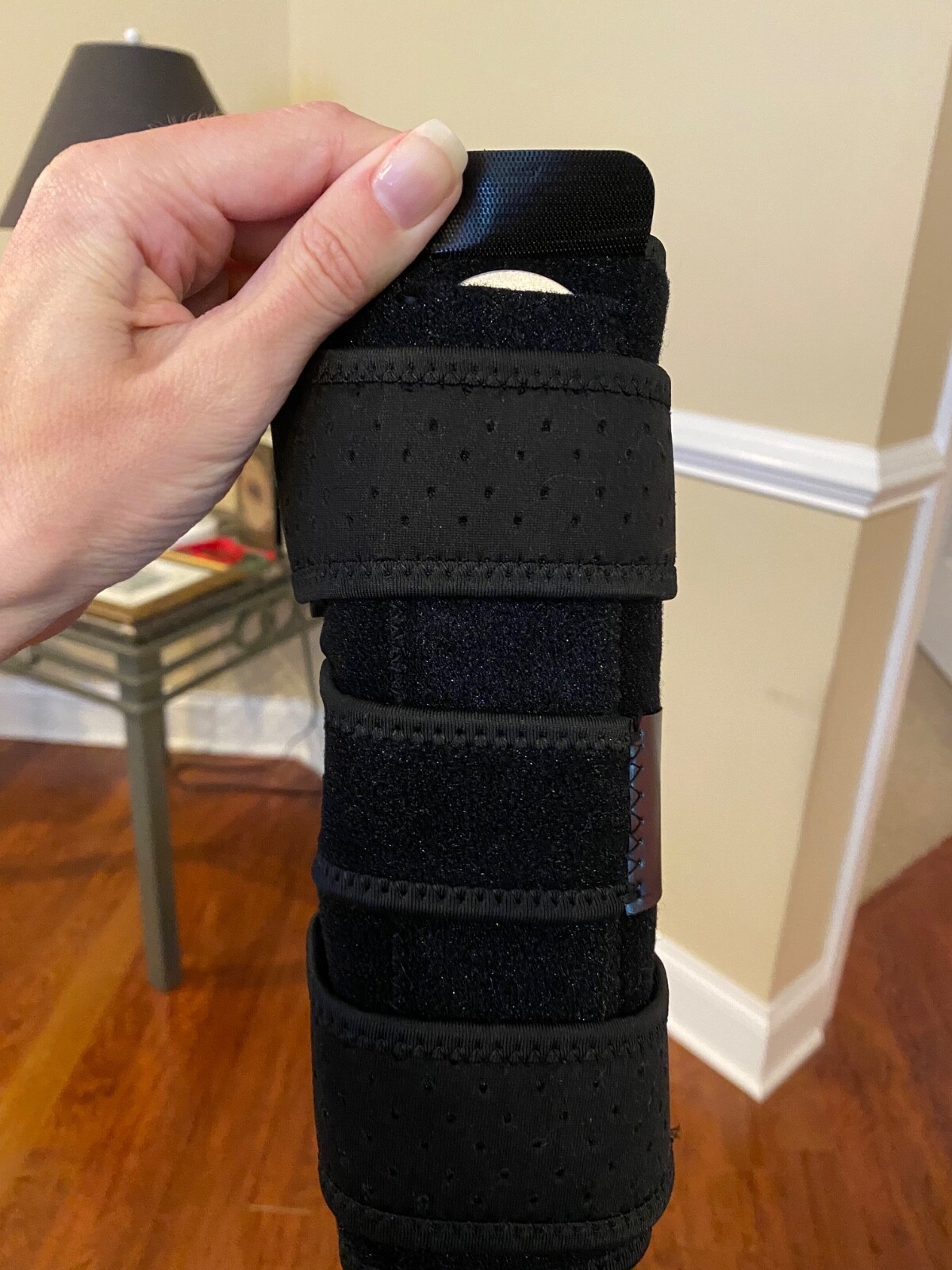 Elbow support brace with 2 metal stabilizers (removable). Adjustable sizing.