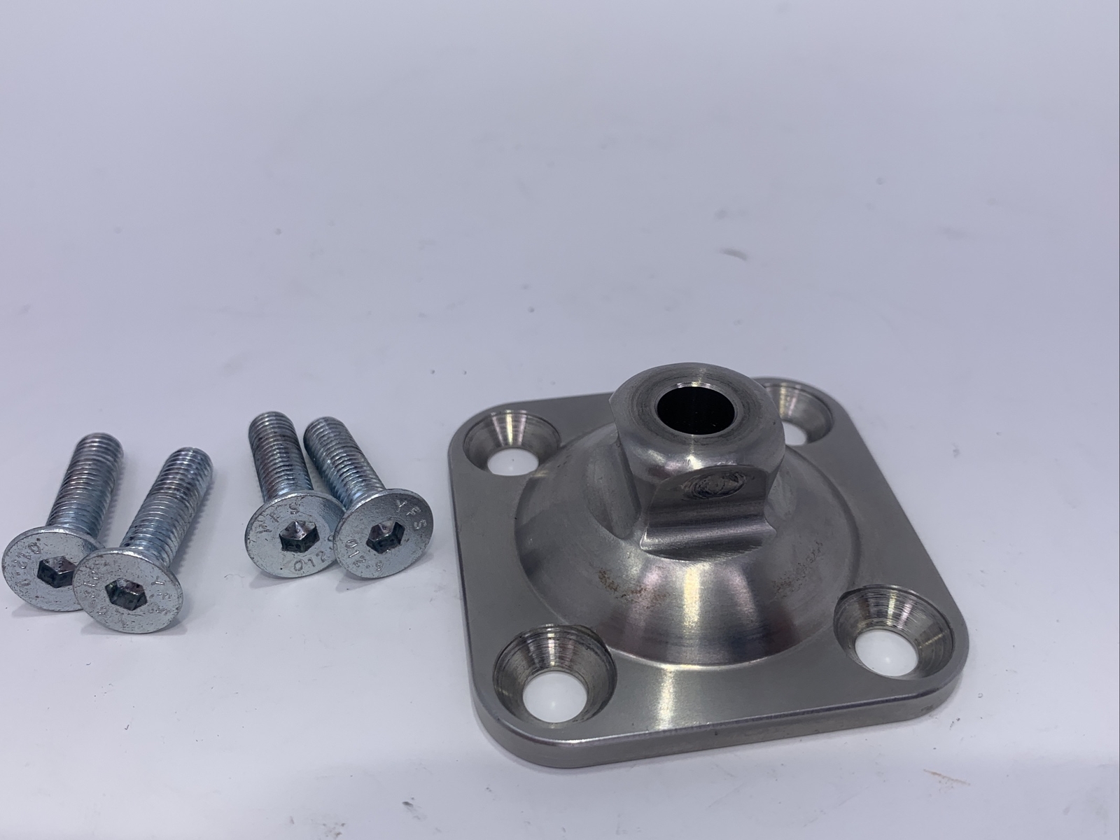 Bulldog prosthetic leg part, component, adapter, 4 hole male pyramid plate.