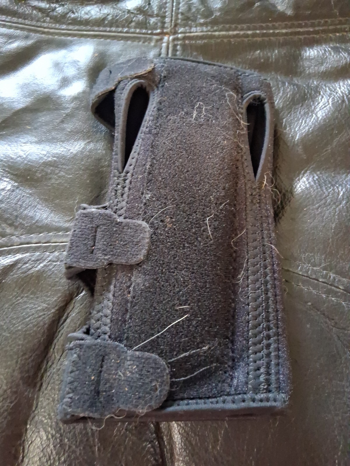 item appears to be a black P-TEX Pro Adjustable Wrist Stabilizer
