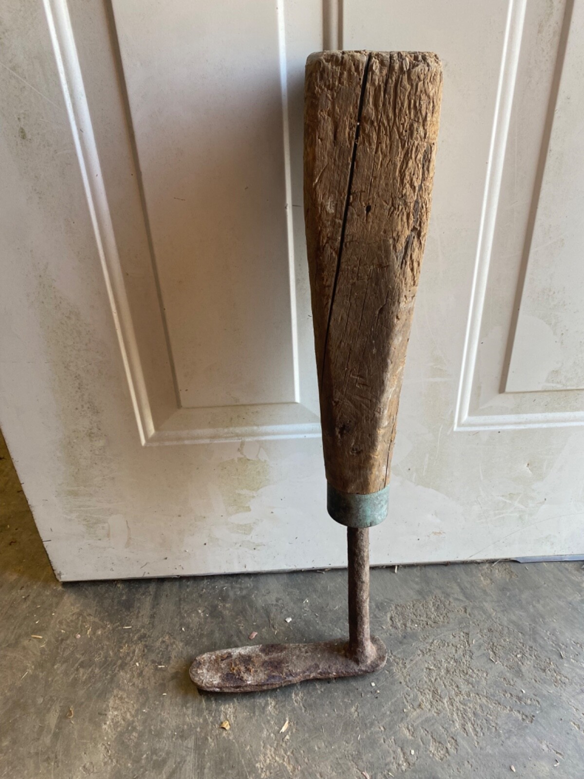 antique prosthetic leg from the 18th century. Iron foot, wooden leg.