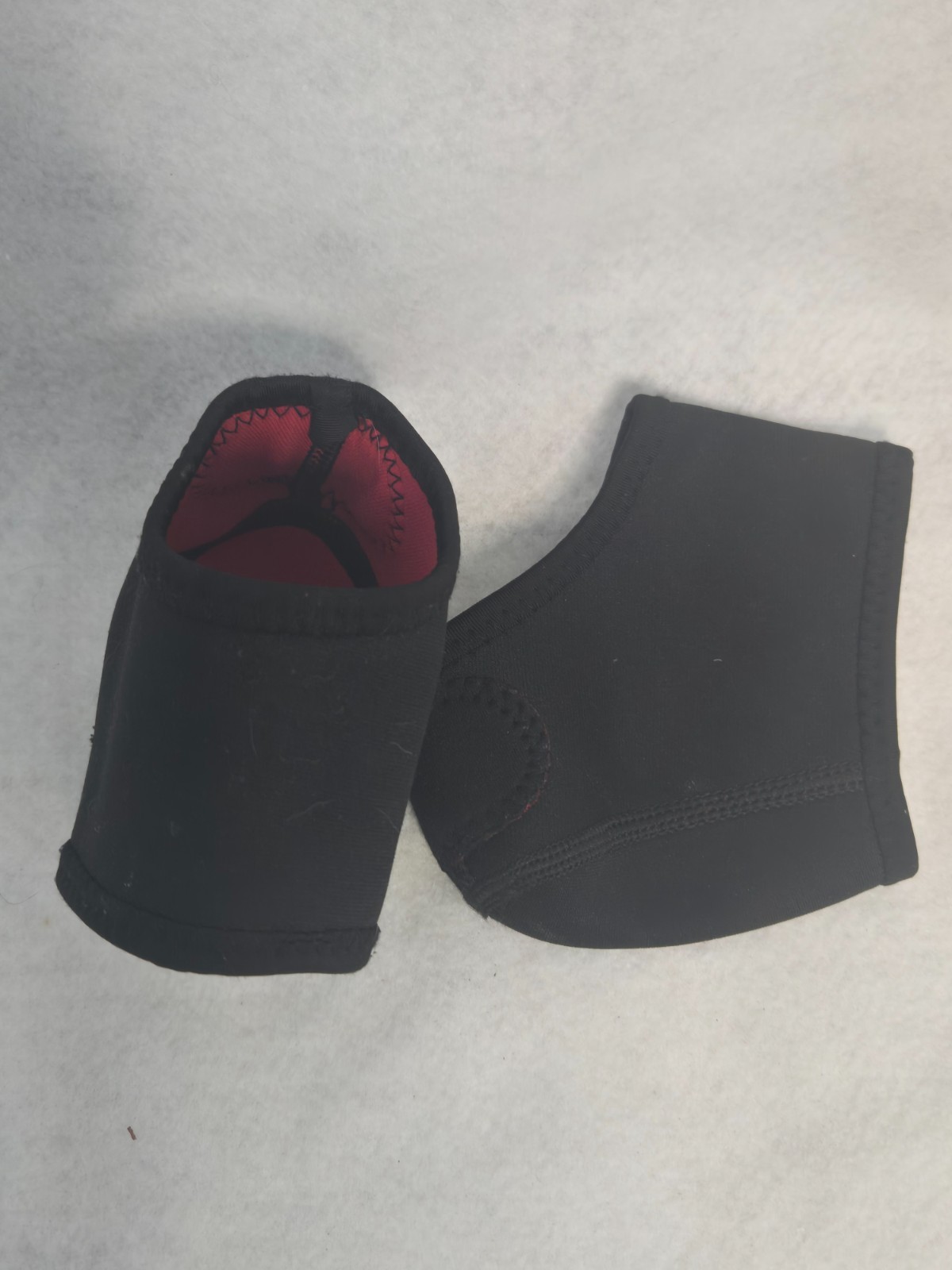 1 pair black neoprene heel and ankle protector, gently used