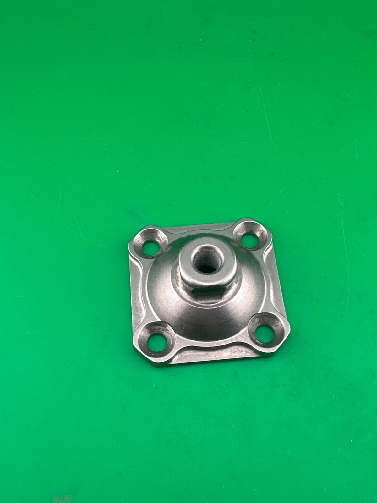 Ossur titanium 4 hole male pyramid prosthetic plate. A-235100.