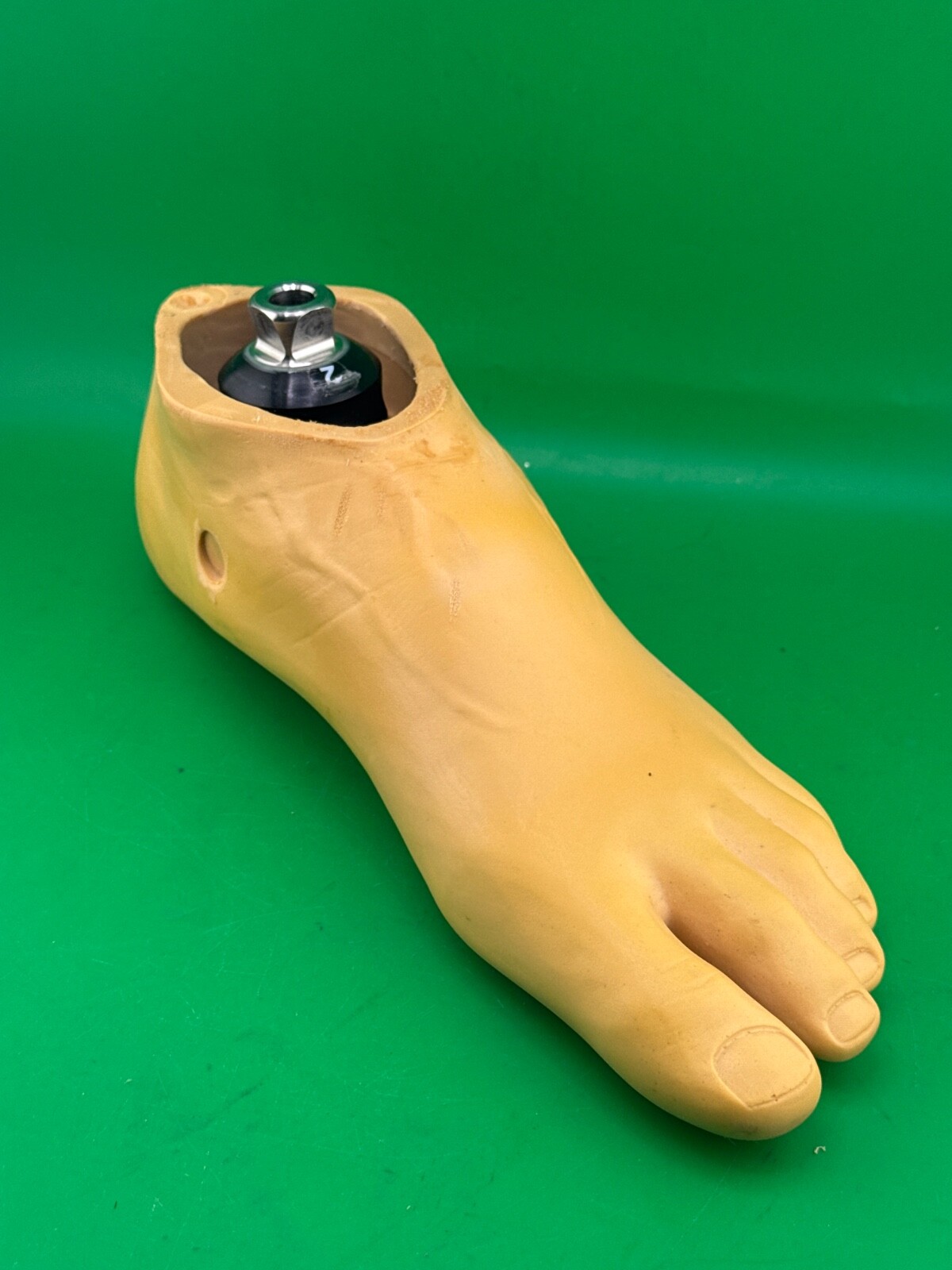 Uniprox single axis prosthetic foot. Left. Size 26