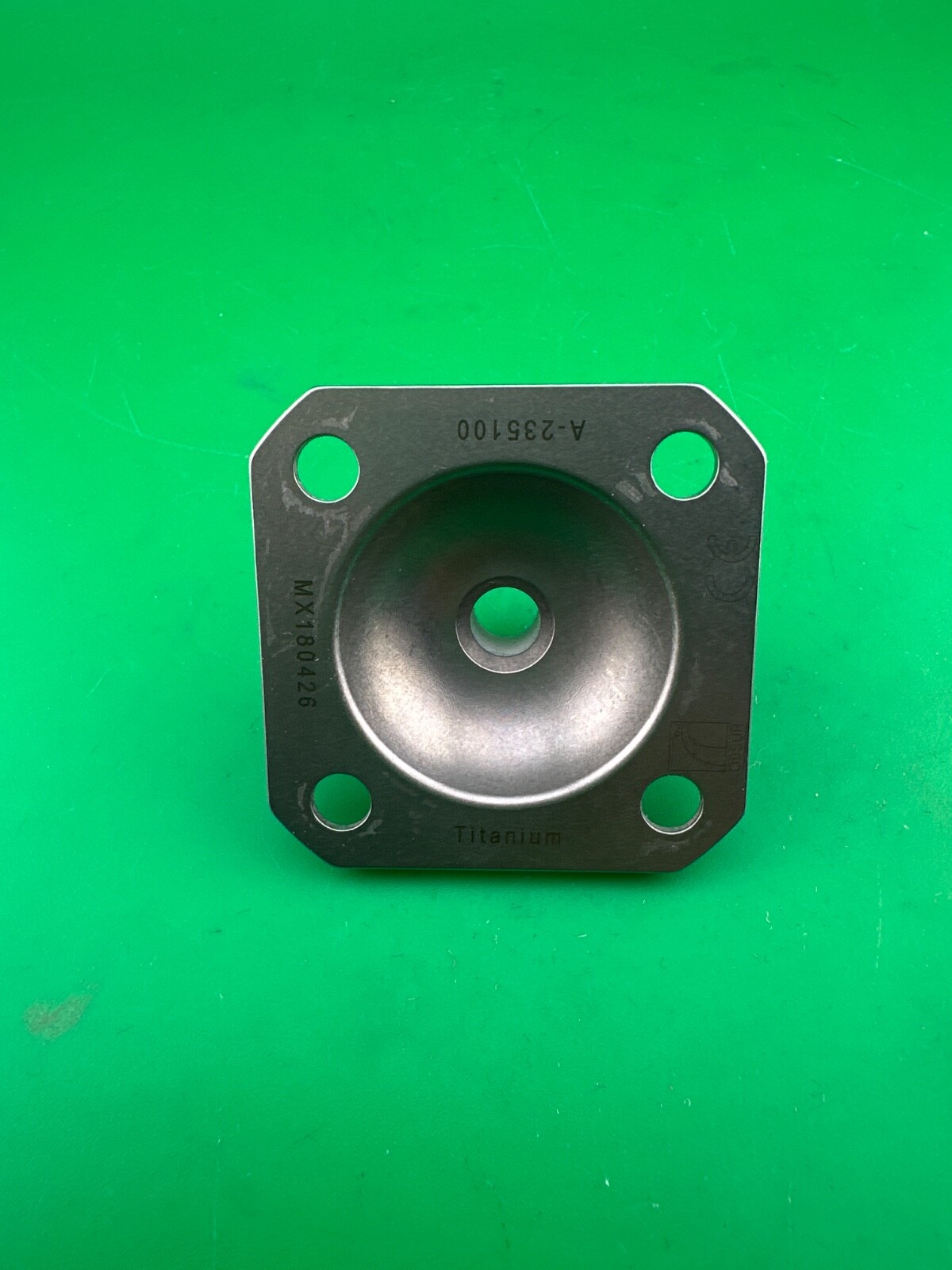 Ossur titanium 4 hole male pyramid prosthetic plate. A-235100.
