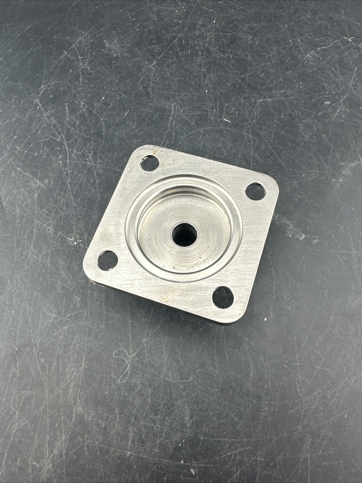 Prosthetic 4 Hole Plate Adapter Component.