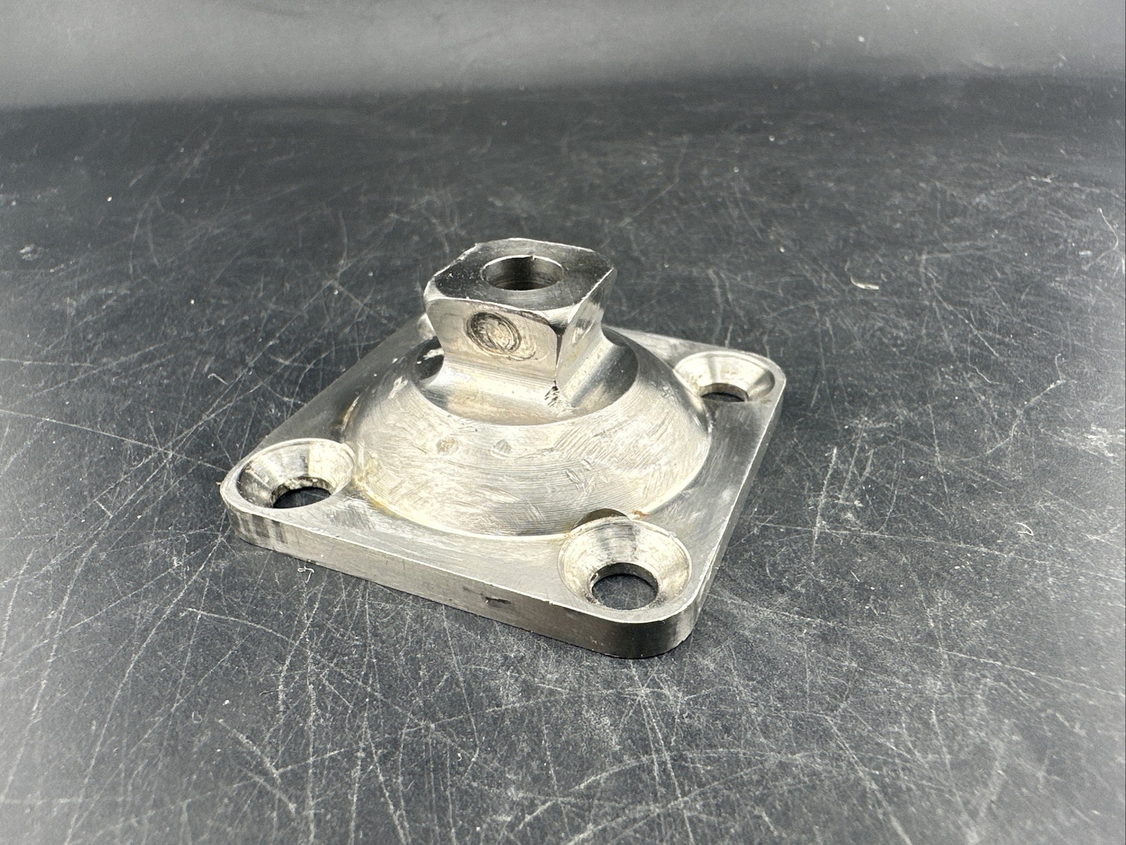Prosthetic 4 Hole Plate Adapter Component.