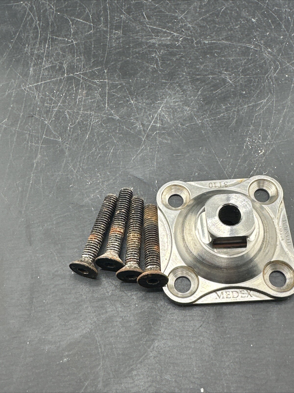 Medex 4 Hole Prosthetic Plate. Titanium.