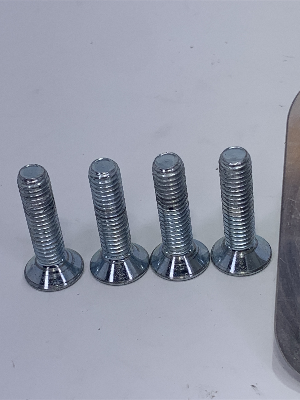 Bulldog prosthetic leg part, component, adapter, 4 hole male pyramid plate.