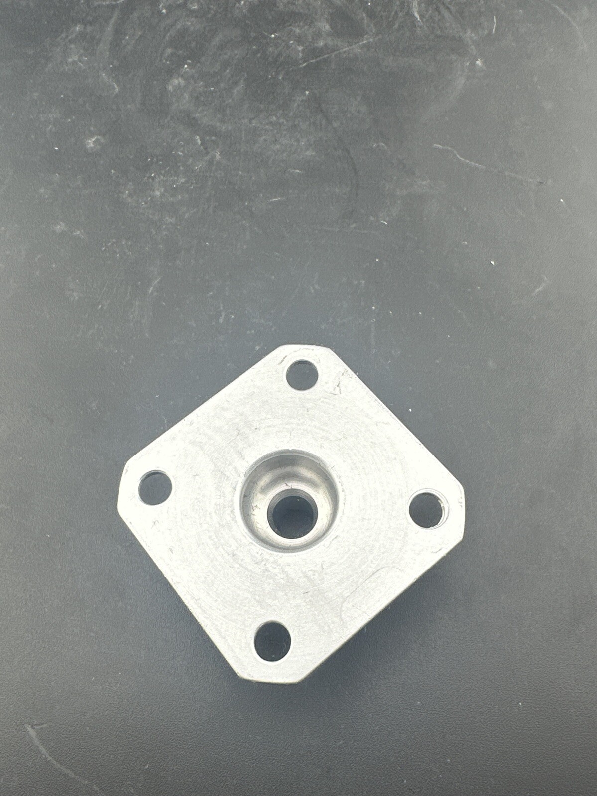 Ossur Prosthetic Four Hole plate Adapter Component.