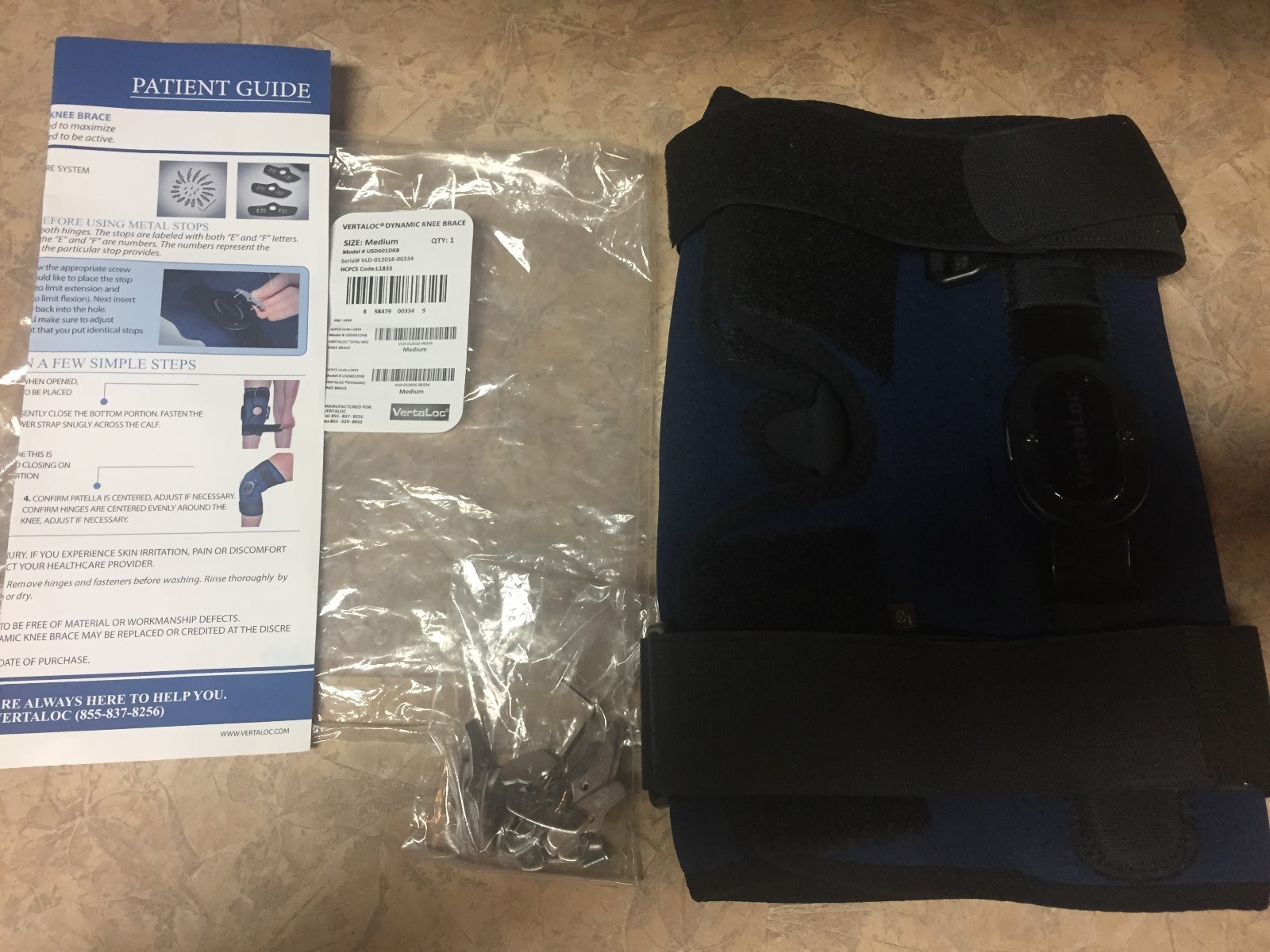 New Vertaloc Dynamic Knee Brace Size Medium Black and Blue sealed in bag