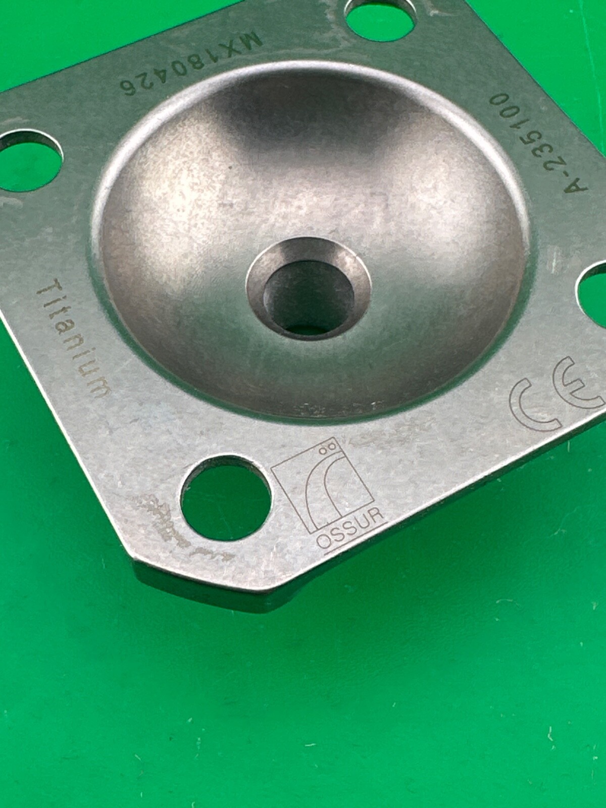 Ossur titanium 4 hole male pyramid prosthetic plate. A-235100.