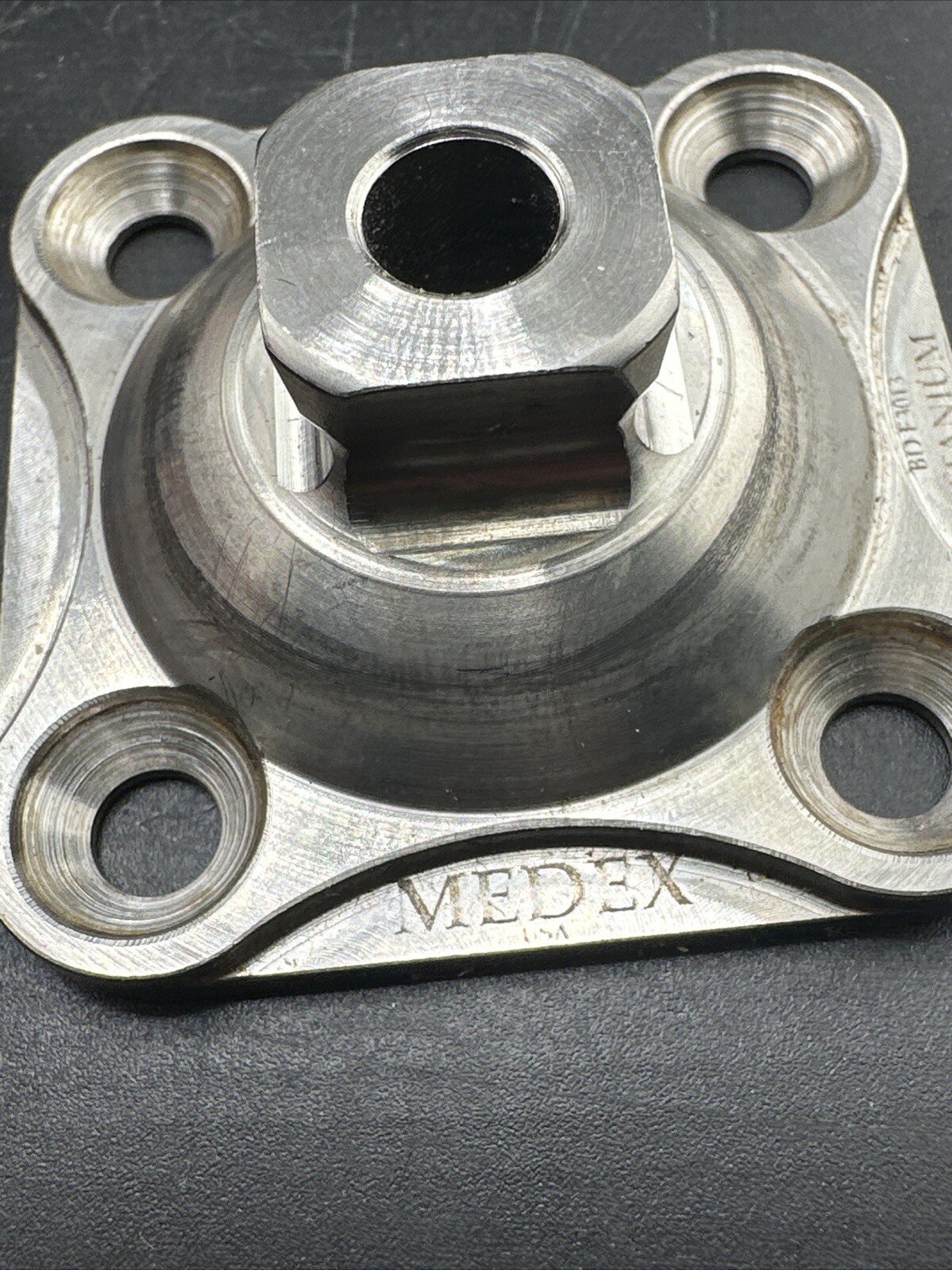Medex 4 Hole Prosthetic Plate. Titanium.