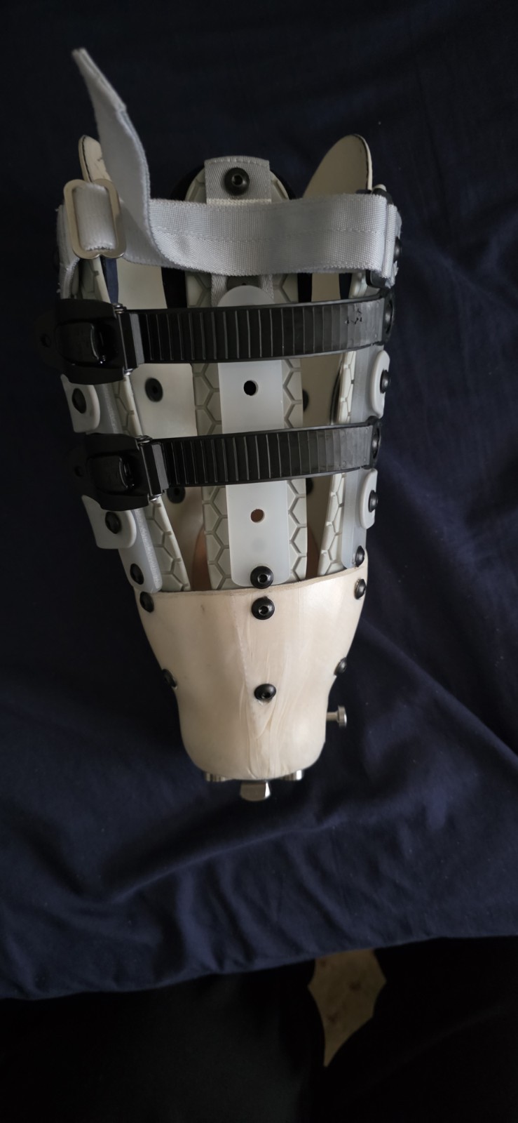 Adjustable Geometric Leg Brace for Stabilization, Beige Gray Black Plastic Foam