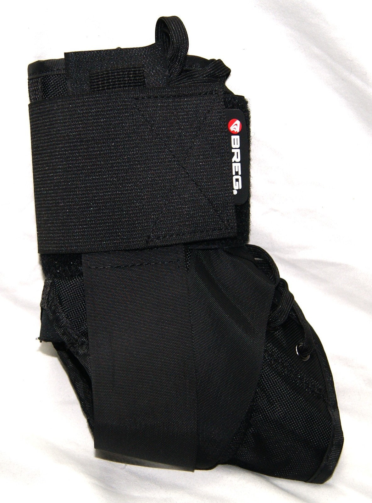 breg ankle brace medium black under foot wrap hook & loop closure