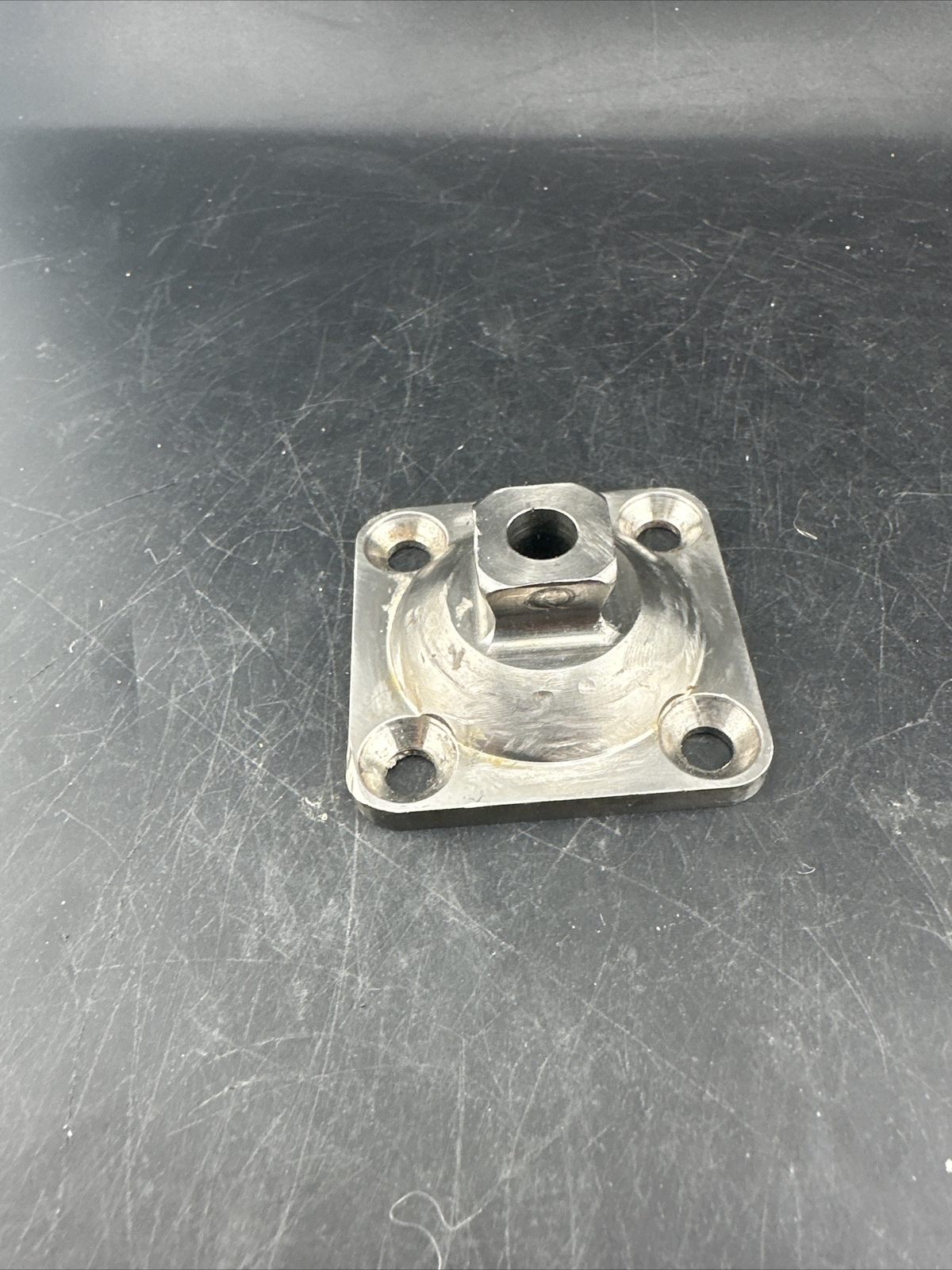 Prosthetic 4 Hole Plate Adapter Component.