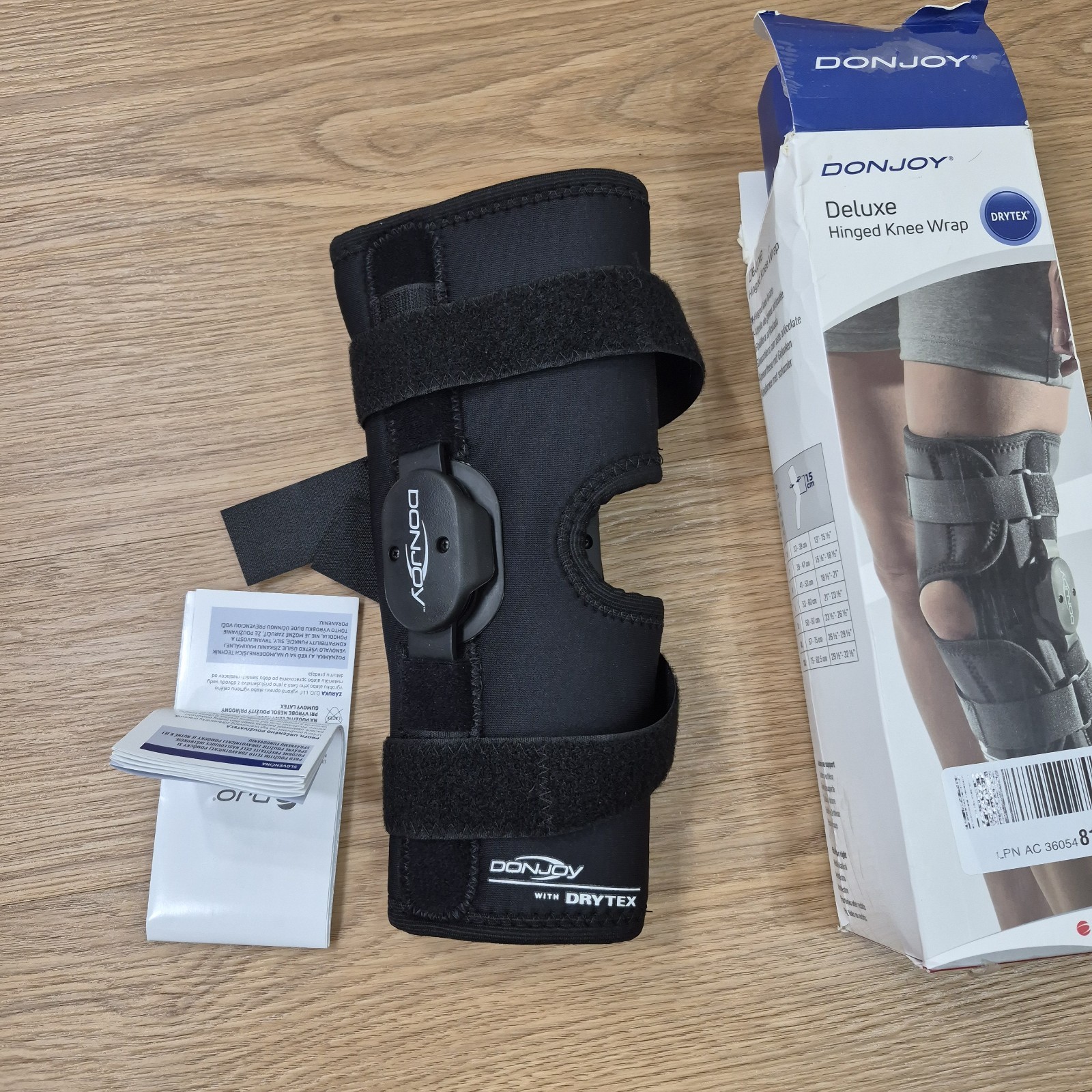 DonJoy Deluxe Hinged Knee Brace Drytex Sleeve Open Popliteal (Small) w/ Med Logo