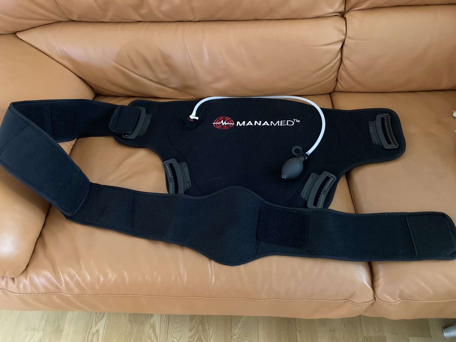 MANAMED TM BACK BRACE ADJUSTABLE. FITS MOST PEOPLE.