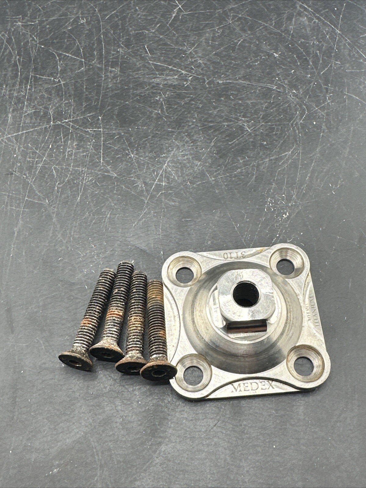 Medex 4 Hole Prosthetic Plate. Titanium.