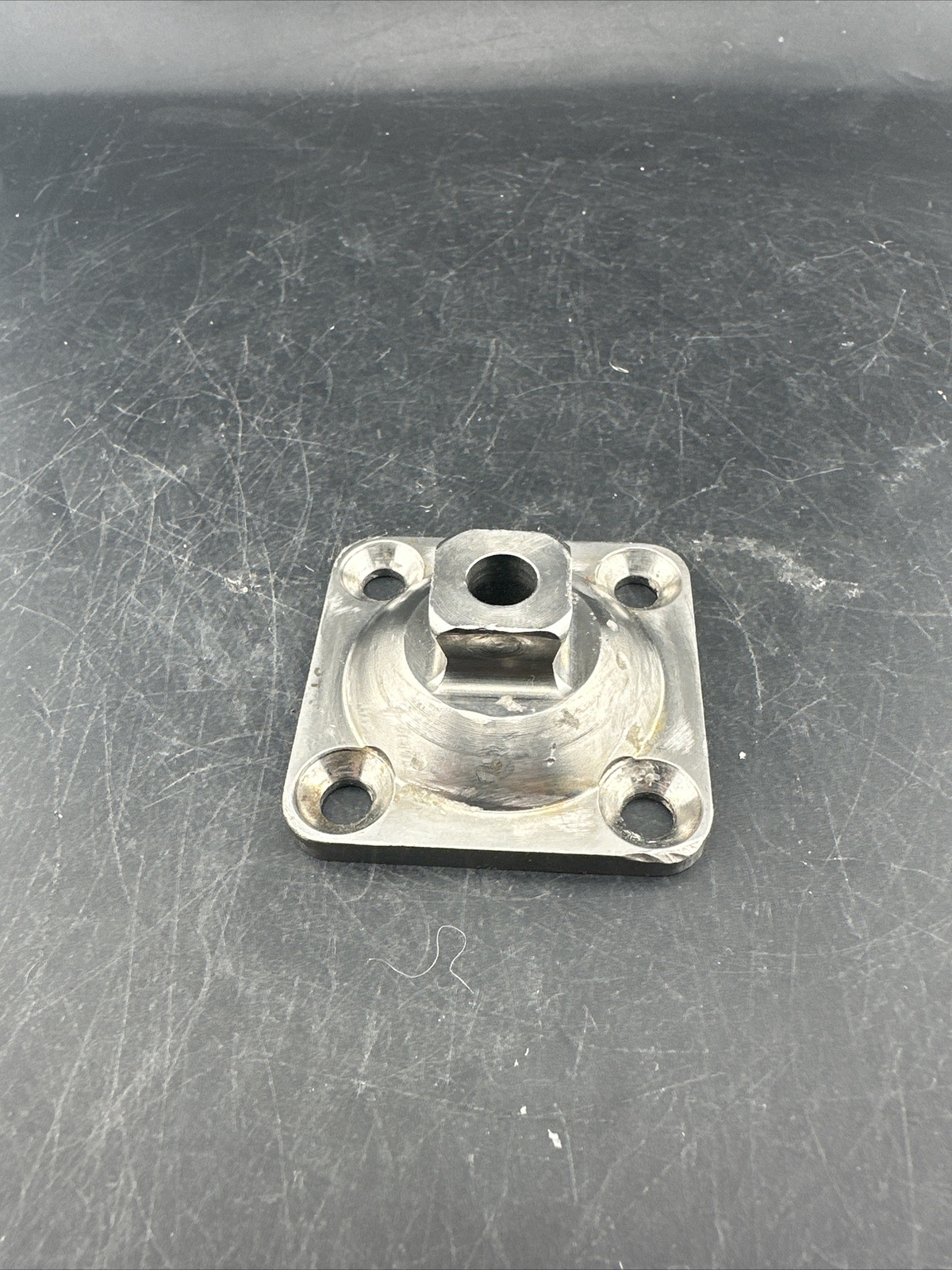 Prosthetic 4 Hole Plate Adapter Component.