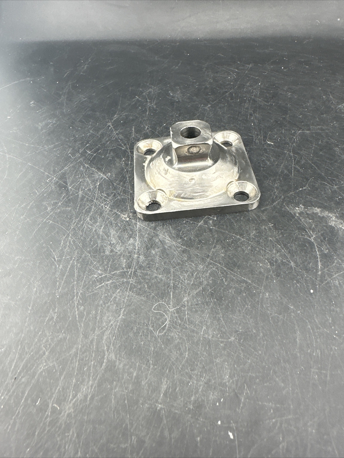 Prosthetic 4 Hole Plate Adapter Component.