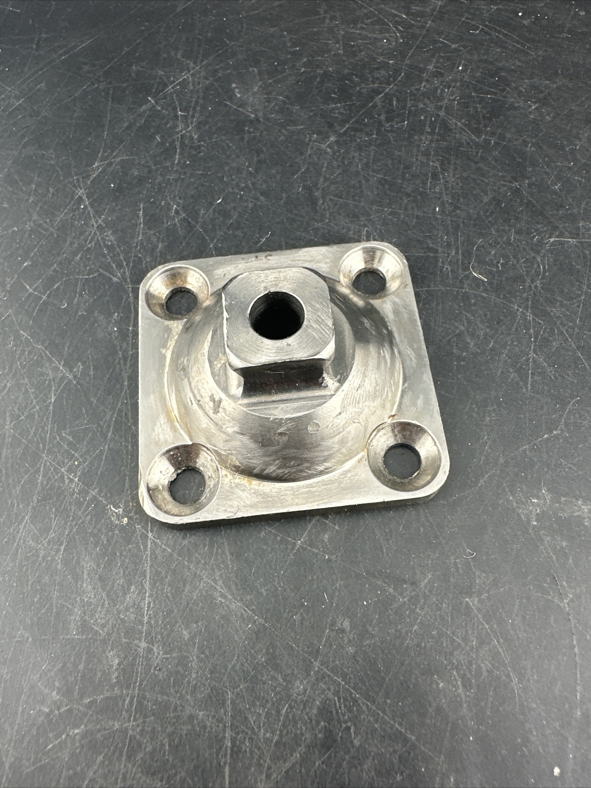 Prosthetic 4 Hole Plate Adapter Component.