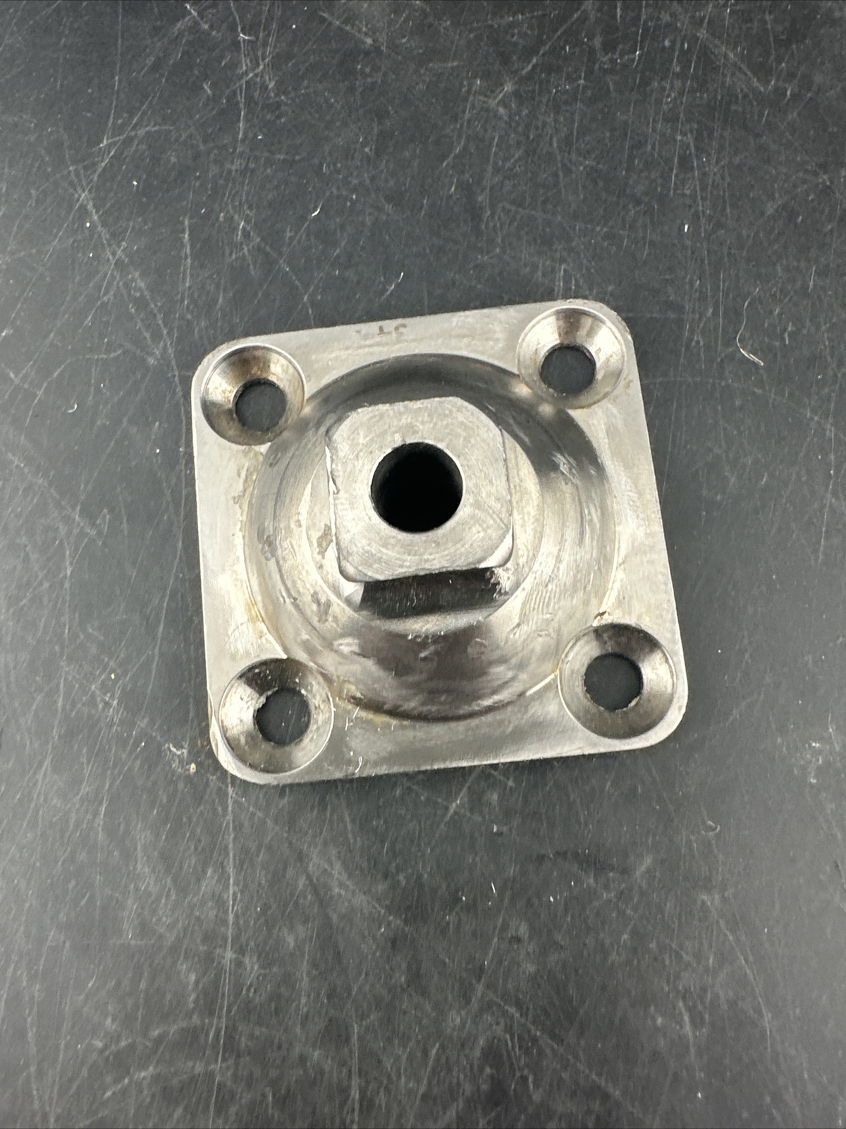 Prosthetic 4 Hole Plate Adapter Component.